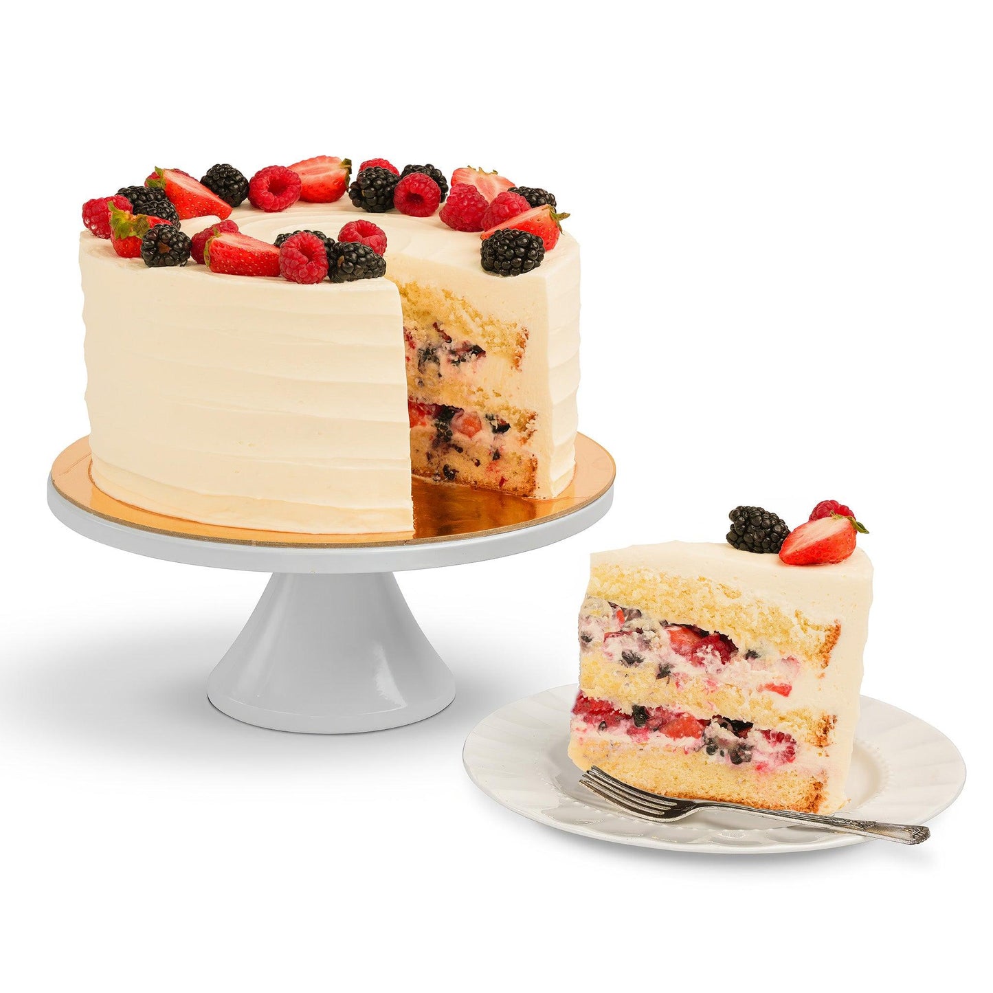 A Berry Cake with a slice removed, revealing layers of fluffy cake filled with fresh berries and cream, served on a plate alongside the whole cake on a white stand.