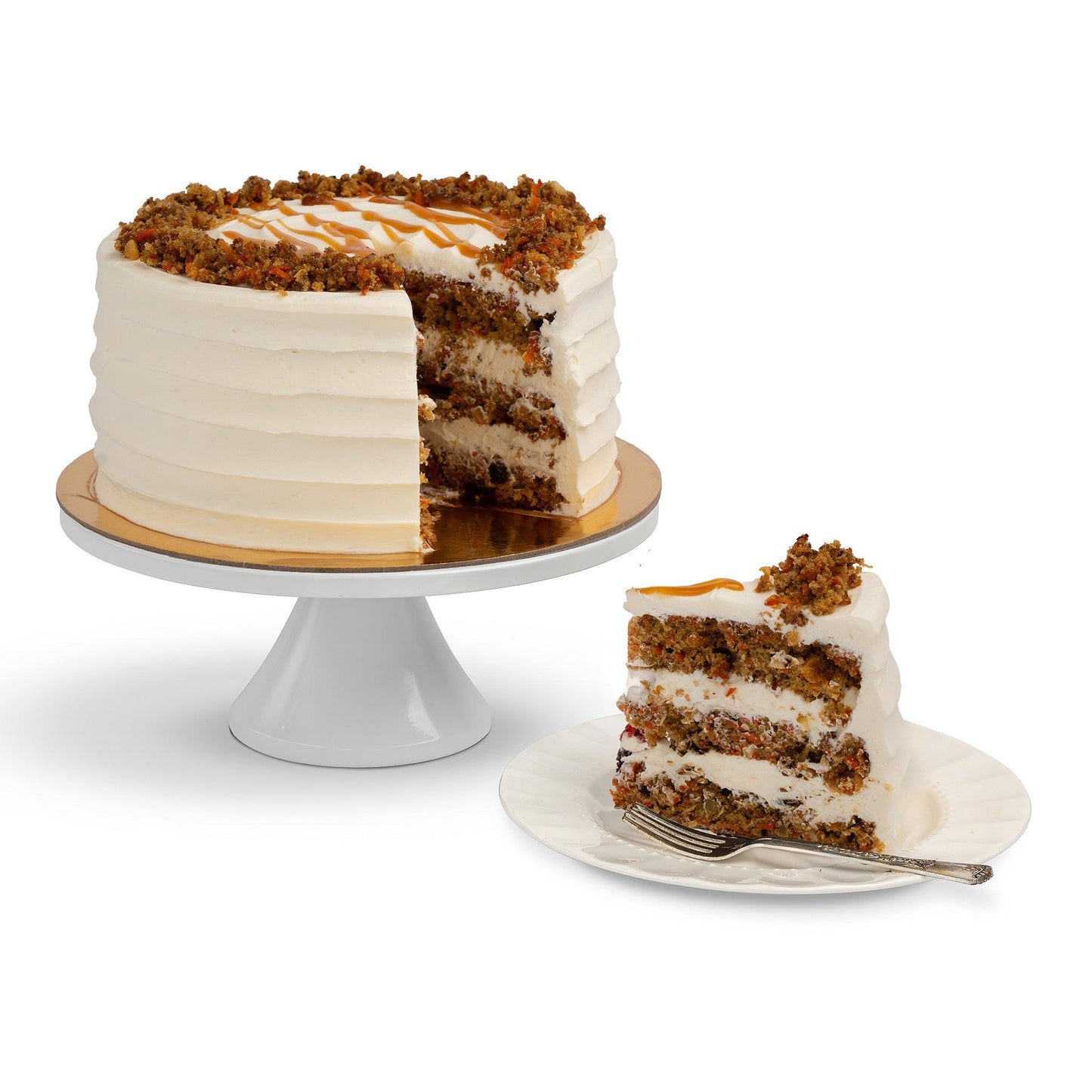 A Carrot Cake with a slice removed, showcasing layers of moist carrot cake and cream cheese frosting, topped with crushed nuts and caramel drizzle, served on a plate