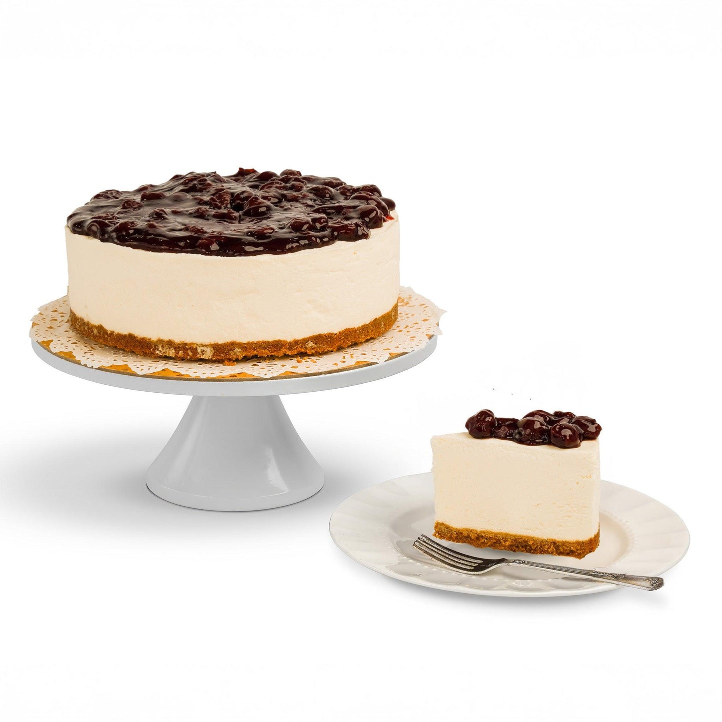 A whole Cheesecake with a slice served on a plate, showcasing a creamy filling, graham cracker crust, and a rich cherry topping, perfect for indulgent moments.