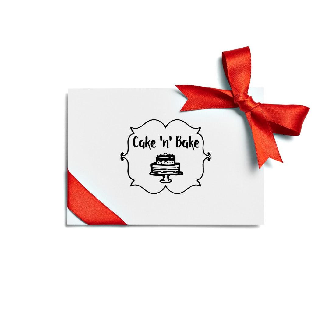 Gift card with the Cake ‘n’ Bake logo featuring a cake illustration, adorned with a red ribbon bow, perfect for gifting sweet treats and custom desserts.